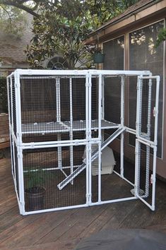 a large white cage on the back deck