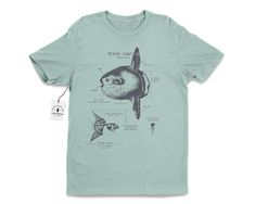 "Wildlife anatomical design of the ocean sunfish that's pressed with hand-mixed inks onto a velvety smooth cotton shirt. The shirt is twined and tagged giving a vintage nautical presentation. Makes a thoughtful gift for any ocean lover in your life. T-shirt stats: * 100% ringspun cotton * Unisex sizing * Shoulder taping * Side-seamed * Pre-shrunk All shirts are silk-screened here in the Life Shines workshop and because of the handmade nature, each t-shirt has a different \"personality\". All ink Marine Biology Shirts, Ocean Sunfish, Anatomy Shirts, Ocean Stuff, Mola Mola, Ocean Shirt, Fish Shirt, Beach T Shirt, Science Tshirts