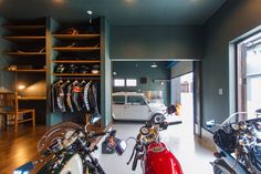 a motorcycle shop with motorcycles parked in front of the store's glass doors and shelves