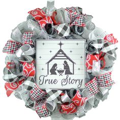 a christmas wreath with the words true story on it and a nativity scene inside