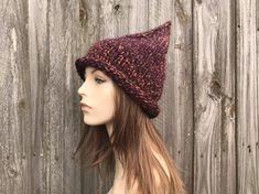 "Style: Chunky pointed gnome or witch hat with a rolled brim. Color: This sample hat is shown in Harvest - Deep Eggplant mixed with Clay, Tangerine, Sunflower Yellow Sizes: One size fits average teen or adult head size of 20\" to 23\" (50.5 cm to 58 cm). Circumference at brim band 19\" (48 cm) unstretched, 14\" (36 cm) in length from unrolled brim edge to tip of crown. Fiber Content: 80% acrylic, 20% Wool Characteristics: Whimsical, chunky, very soft, warm and cozy. Care Instructions: Hand wash, Harvest Witch, Halloween Costume Womens, Hat Halloween Costume, Wizard Hat, Crochet Santa, Chunky Knit Hat, Mens Hat, Pixie Hat, Handmade Knitwear