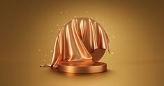 an image of a gold object on a brown background with some light coming from it