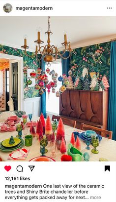 the dining room table is set with colorful dishes