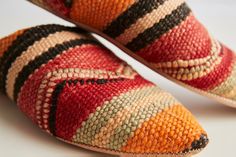 Like snowflakes or fingerprints, no two pairs of our Kilim House Slippers are alike. Each pair will be varied in color and pattern. If you would like to request a particular color tone, please request in notes in your shopping cart. We will do our best to accommodate. Style... Our Moroccan Kilim Slippers are produced in the pointed Arab style that took Parisian fashion houses by storm in the 17th century. ...and Substance Kilim, a Turkish flat-woven style of textile, was first popularized by rug Moroccan Shoes, Moroccan Textiles, Moroccan Kilim, Arab Fashion, Goat Leather, Clothes Horse, House Slippers, Comforters Cozy, Product Photos