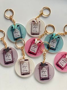 six key chains with tags attached to them