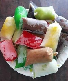 a paper plate filled with different types of food