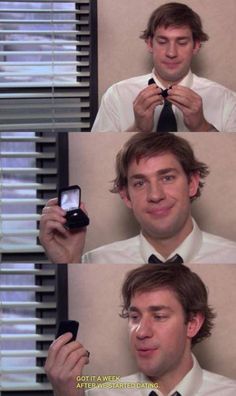 a man in a white shirt and black tie holding a cell phone to his face