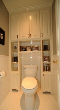 a white toilet sitting inside of a bathroom