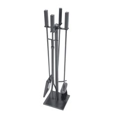 a metal stand with three candles on it and two knives sticking out of the top