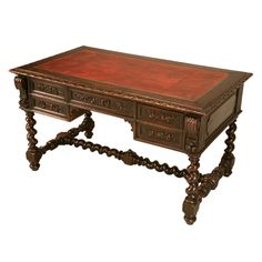 an old wooden desk with two drawers on one side and ornate carvings on the other