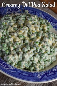 creamy dill pea salad on a blue and white plate