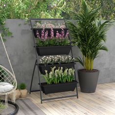 three tiered plant stand with plants in it