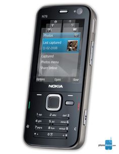 an old nokia cell phone with pictures on the screen and texting in english or spanish