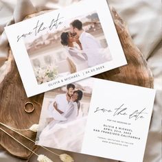 wedding save the date cards on top of a wooden slice