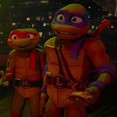 teenage mutant ninja turtles standing next to each other in front of a city at night