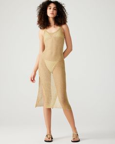 Upgrade your swim coverup game with the ANISHA dress. This metallic gold beauty features an open stitch design and sheer fabric, making it the perfect midi dress or swim coverup. Embrace the sunshine and feel glamorous in this sleeveless, shimmering piece. Open stitch metallic midi dress Can be used as a swimsuit coverup Unlined Length: 49" 76% polyester 24% metallic Hand wash cold separately, do not bleach, lay flat to dry, low iron if necessary, or dry clean Mily is 5ft 10in and is wearing a s Sheer Mesh Dress For Beach Season Vacation, Sheer Mesh Dress For Beach Vacation, Gold Midi Dress For Summer Party, Metallic Sleeveless Summer Dress, Sheer Mesh Dress For Summer Beach Cover-up, Spring Mesh Dress For Beach Cover-up, Sheer Mesh Dress For Vacation, Gold Beach Dress For Summer, Gold Summer Beach Dress