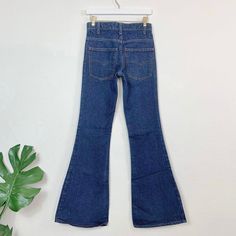 Vintage 70s 684 Orange Tab Dark Wash Levi's//Slim fit/Bellbottom leg. 28" waist, 10" rise, 34" inseam, 33" hips, 31.5" upper hip, 19" thigh, 23.5" leg opening. Will fit a size XXS/23 best imo, maybe a 24 with very slim hips/thighs, but please compare your measurements and ask me questions. Great quality 100% cotton denim and these actually hug your butt! Price firm We ship internationally! SV01888 Fitted Mid-rise Bottoms With Pockets, Retro Mid-rise Stretch Flares, Retro Mid-rise Jeans With Pockets, Retro Wide Leg Bottoms For Fall, Retro Flares For Fall, Retro Fall Flares, Classic High Rise Bottoms With Hip Pockets, Retro High Rise Stretch Flare Jeans, Fitted High Rise Bottoms With Five Pockets