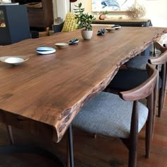 a large wooden table with chairs around it