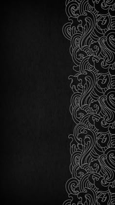 a black background with white swirls on it