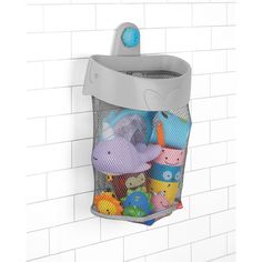 a mesh trash can filled with toys on a wall mounted hook in a bathroom stall