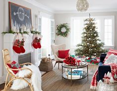 a living room filled with furniture and christmas decorations