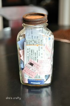 a jar filled with lots of different types of tickets