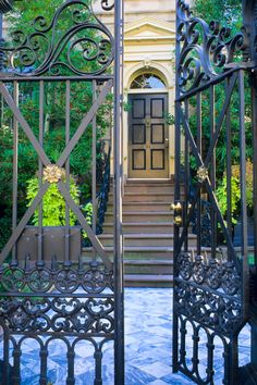 an iron gate is open to let people know where they are going