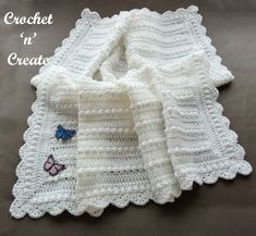 a crocheted blanket with butterfly applique on it and the words crochet in'create '