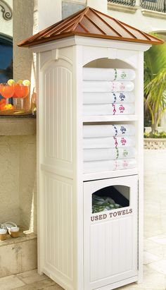 a white outdoor storage unit with towels on it's top and the words used towels written in english