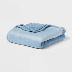 a blue blanket folded on top of each other