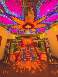 an elaborately decorated room with lots of colorful decorations on the walls and ceiling,