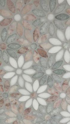 a close up view of a tile with flowers on it