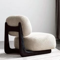 a white chair sitting on top of a rug