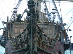 an old pirate ship with skeleton decorations on it's hulls and rigs