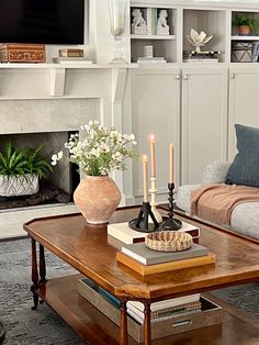 a living room filled with furniture and a fire place