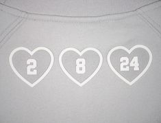 three hearts with numbers on them are shown