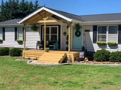 a small white house with a front porch