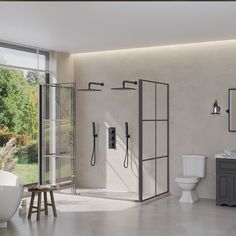 a bathroom with a tub, toilet and shower in it's center wall is shown