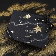 a black box with gold stars on it