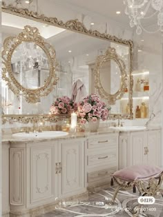 a fancy bathroom with two sinks and large mirrors