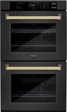 two black ovens side by side with gold trim on the front and bottom doors