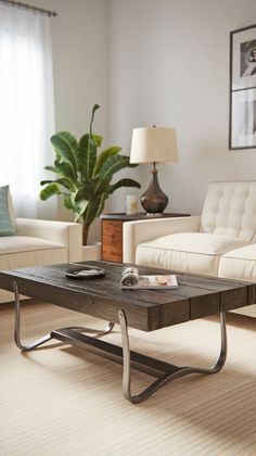 a living room with two couches, a coffee table and a plant in the corner