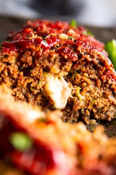 the meatloaf is stuffed with cheese and vegetables