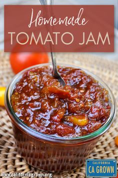 homemade tomato jam in a glass bowl with a spoon on the side and text overlay