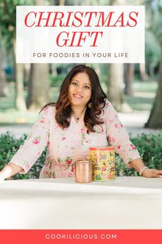 a woman standing behind a table with food on it and the words christmas gift for foodies in your life