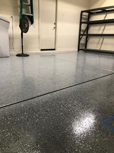 a garage floor with blue lines painted on it