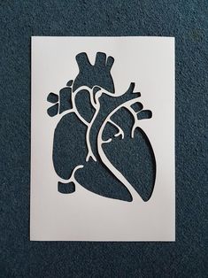 a paper cut out of a human heart