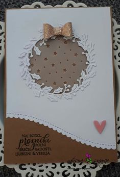 a close up of a card with a bow on it