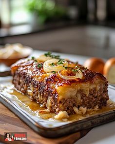 a piece of meatloaf sitting on top of a pan