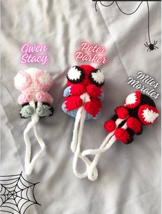 three crocheted mice on a bed with spider web attached to the top one